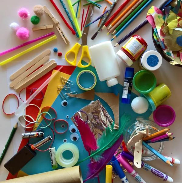 scattered craft supplies on a table