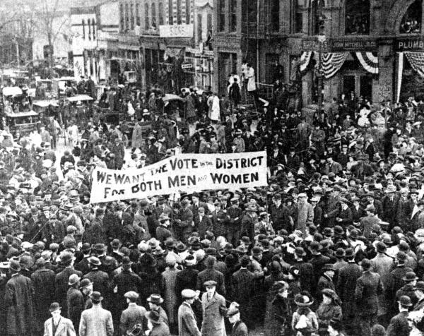 Crowds marching for women's rights, early 1900s