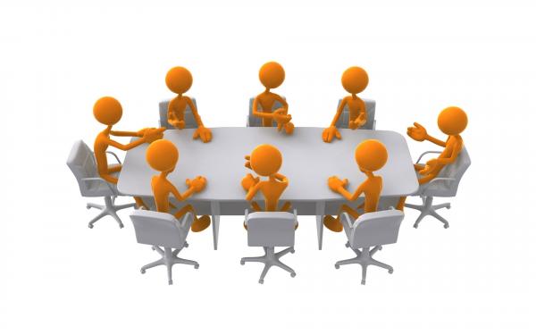 orange people icons sit around a grey table