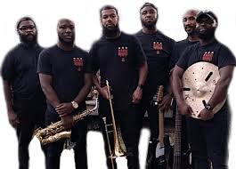 six musicians stand with their instruments
