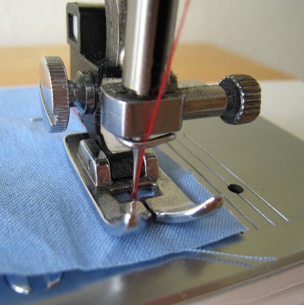 Closeup of a sewing machine foot.