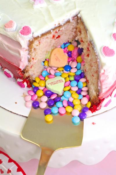 A cake cut open to reveal candy