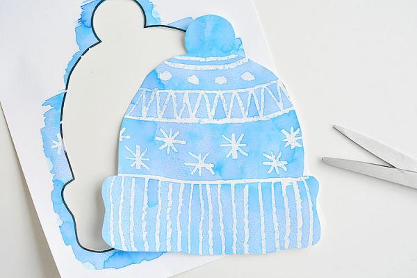 water color winter hat cut out of paper
