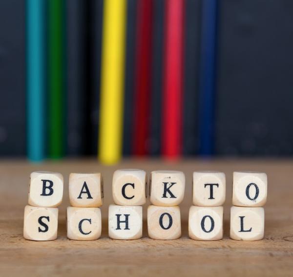 Photo of wooden blocks stacked to spell: Back to school 