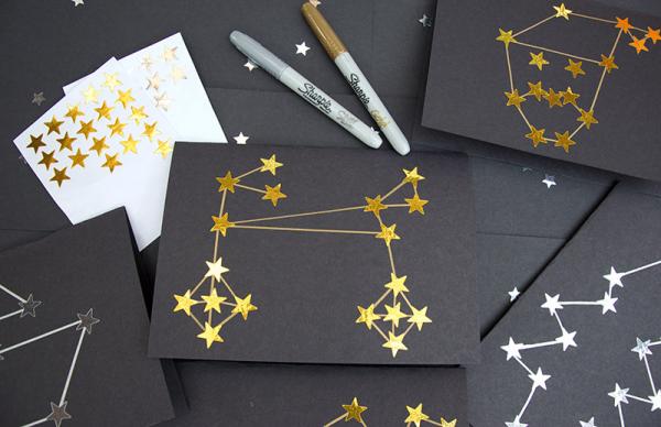 image of constellations made from gold star stickers on black paper