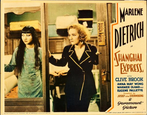 A film still of Anna May Wong and Marlene Dietrich accompanies an advertisement for Shanghai Express.