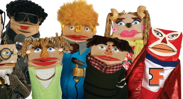 Paper bag puppets of different characters, including a blind person, a person with a blond curly hair, a person with two braids, a person with short hair and earrings, a person with short brown hair and a superhero