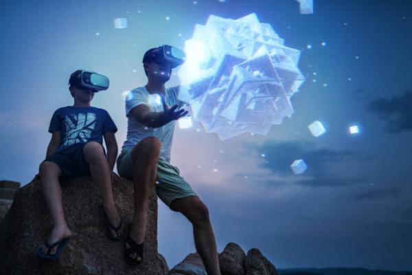photo of two kids in VR headsets