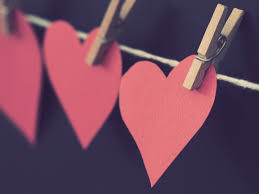 paper hearts hanging on a clothesline 