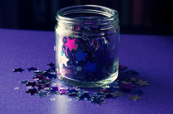 image of a jar filled with star shaped glitter