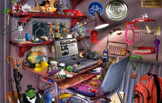 "I Spy" themed photo of a desk and shelves with many things on it
