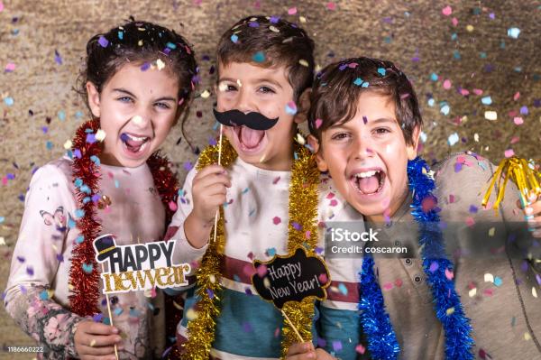Three children celebrating the new year 
